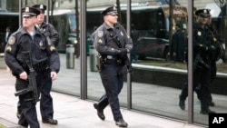 Boston police patrol near the finish line of the Boston Marathon following an explosion in Boston, April 15, 2013. 